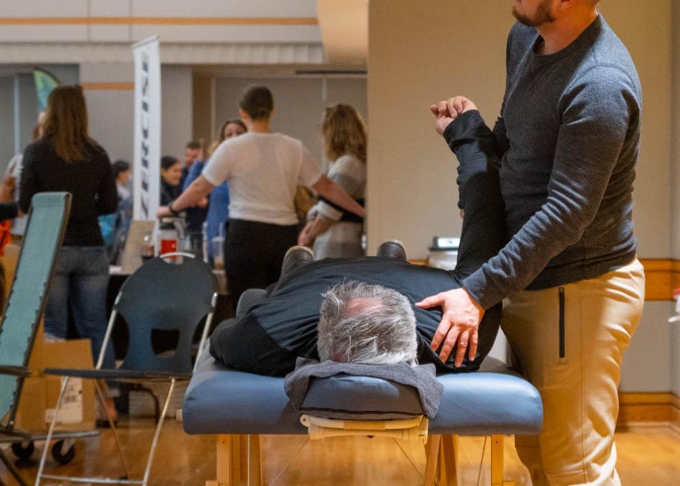 A fair attendee gets a table massage